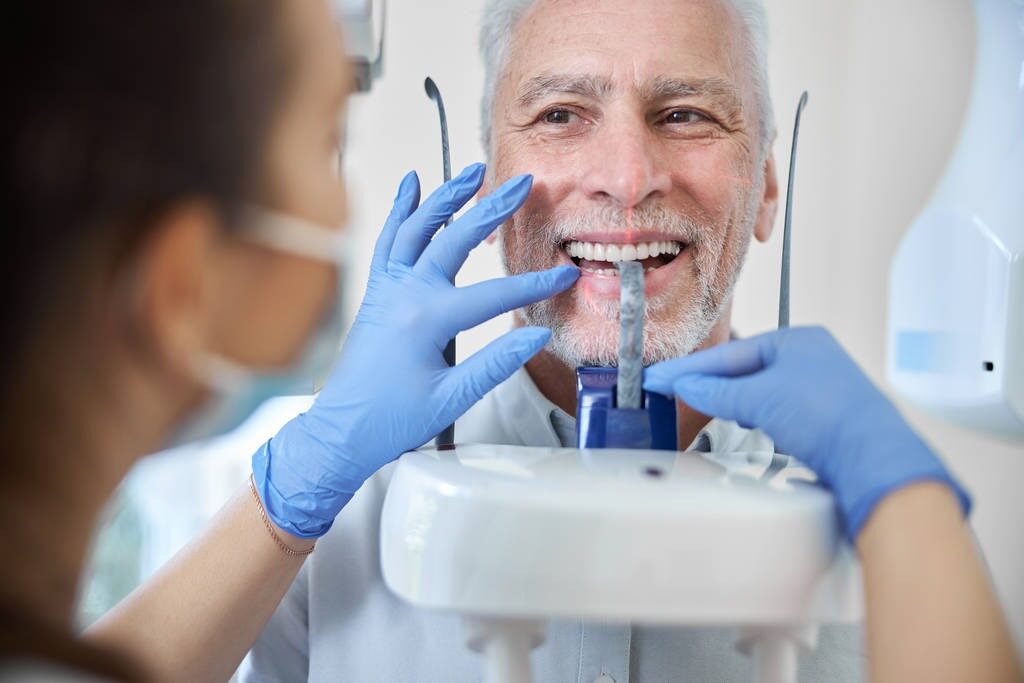 Pensioner getting prepped for dental implant procedure
